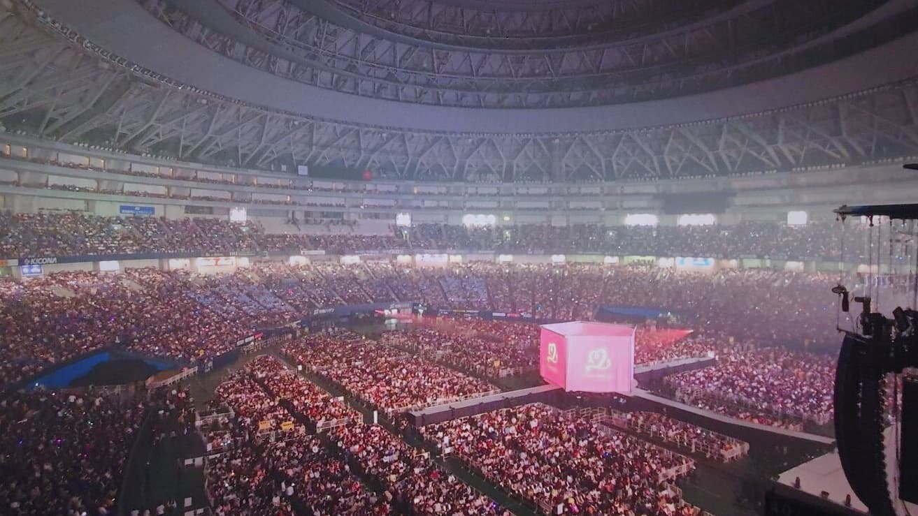 A packed stadium crowd at a major concert — the scale TWICE will bring to Japan National Stadium in April 2026